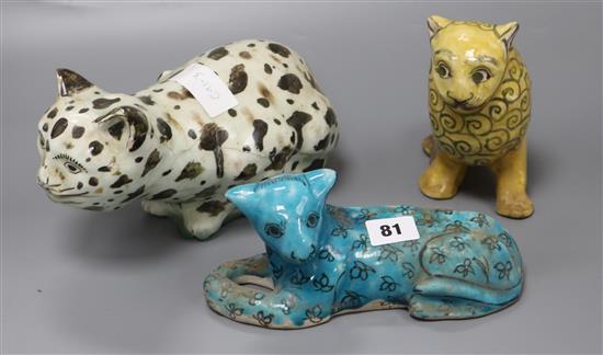 Two Persian fritware figures of cats and a lion